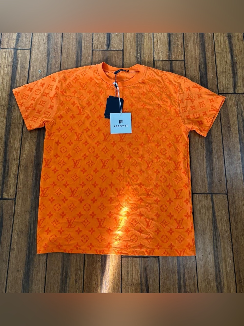 orange monogram t-shirt with repeating LV logo pattern. - louis vuitton